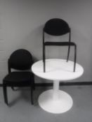 A white office table and five Narbutas stacking chairs