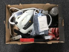 A box of Yankee candle, wireless mouse, Sagem mobile phone, Timex radio alarm clock,