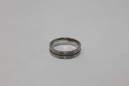 A Titanium wedding band, size S CONDITION REPORT: 6.
