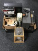 A box of leather briefcase, key safe, Sony cassette radio, Sony Walkman, hurricane lamp,