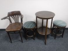 A circular two tier bentwood bar table with two stools together with a bentwood armchair