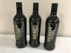 Three bottles of Besos De Ore brandy,