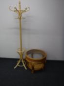 A Bentwood hat and coat stand and a wicker circular table