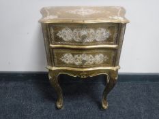 A gilt embossed two drawer French style bedside chest