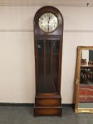 An early 20th century oak regulator clock with silvered dial,