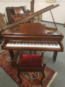 A mahogany cased Steindorf baby grand piano retailed by Waddington & Sons Ltd, Newcastle Upon Tyne,
