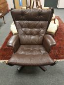 A Danish brown leather relaxer chair,