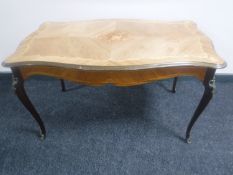 A continental Kingwood coffee table with metal mounts