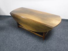 A mahogany narrow flap-sided coffee table