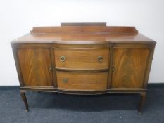 An Edwardian mahogany Queen Anne style sideboard