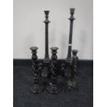 A pair of antique cast bronze column candlesticks, height 55.