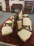 A six-piece mahogany salon suite comprising of pair of two-seater settees and a set of four chairs