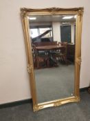 A Victorian style gilt bevelled overmantel mirror,