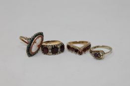 A ruby and diamond set ring, a garnet wishbone ring,
