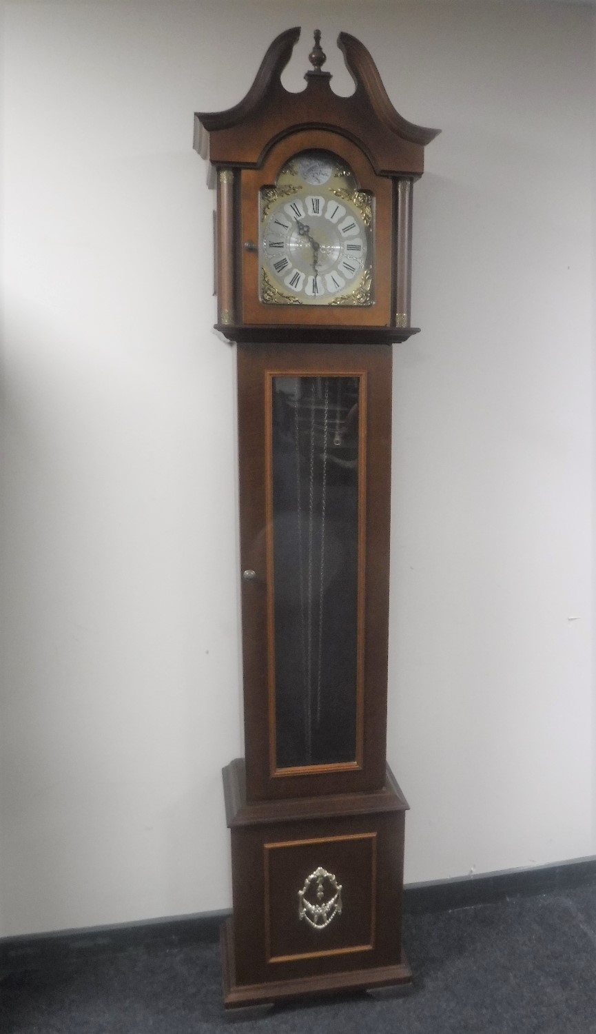 A Tempus Fugit longcase clock with pendulum and weights