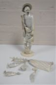 An antique ivory figure modelled as a fisherman with fish, signed to base, height 20.5 cm.