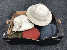 A box of eleven assorted military hats