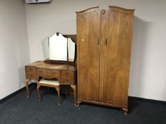 A 20th century walnut double door gentleman's wardrobe together with kneehole dressing table and