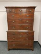 A George III oak chest on chest fitted ten drawers,