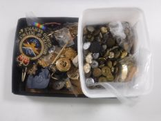 A large collection of military badges,