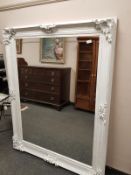 A Victorian style white painted mirror 114 cm x 144 cm
