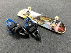 A Tony Hawks Signature Series skate board together with a pair of Cardiff Skate Company Cruiser
