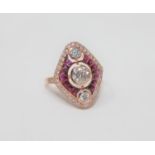 A 14ct rose gold ruby and diamond ring, featuring 1 round brilliant cut diamond 0.