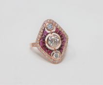A 14ct rose gold ruby and diamond ring, featuring 1 round brilliant cut diamond 0.