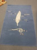 A hand-knotted rug with leaf design on blue ground,