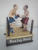 A cast iron novelty boxing match money box