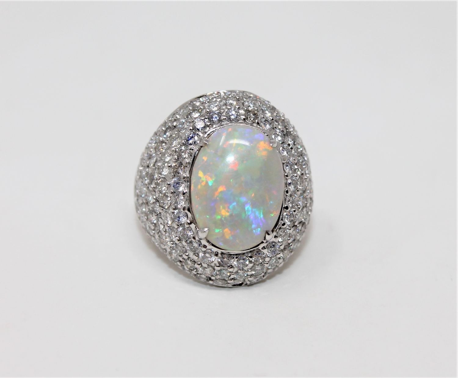 An 18ct white gold opal cocktail ring featuring a cabochon opal 4.