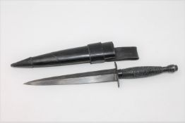 A mid 20th century Fairbairn Sykes type commando dagger in sheath,