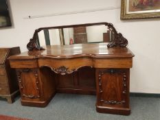 A Victorian mahogany mirror backed serpentine fronted twin pedestal sideboard, width 197 cm.