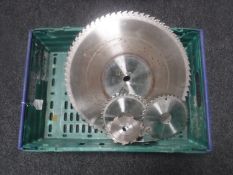 A crate of eight circular saw blades,