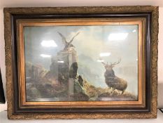 A Victorian mahogany and gilt framed print depicting a stag and eagle in highlands