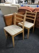 A narrow pine drop leaf kitchen table together with a pair of 1970's ladder back chairs