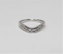 An 18ct white gold diamond set ring, the stated total diamond weight 0.33 carat, size M.