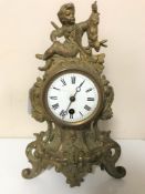 An antique gilt continental mantel clock with enamel dial