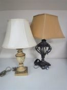 A decorative metal table lamp with shade together with a painted wooden table lamp with shade