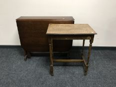 A narrow oak drop leaf table together with an Edwardian oak side table fitted a drawer