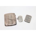 Two silver vesta cases together with a silver cigarette case.