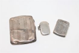 Two silver vesta cases together with a silver cigarette case.
