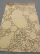 A hand-knotted rug on cream ground,