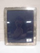 A large silver picture frame 25 cm x 30 cm CONDITION REPORT: No rear stand.