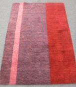 A hand-knotted rug of striped design,