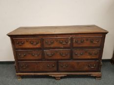 A George III oak dresser with lift up top fitted with drawers beneath, width 163 cm.