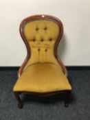 A stained beech framed lady's chair upholstered in a mustard dralon fabric