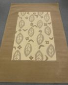 A hand-knotted rug with embossed pattern on cream and brown ground,