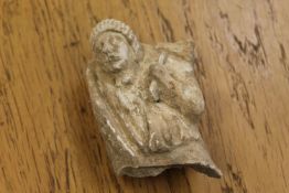A medieval carved sandstone figure, believed Indian, height 9.