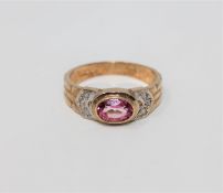 A 9ct gold pink topaz and diamond ring,